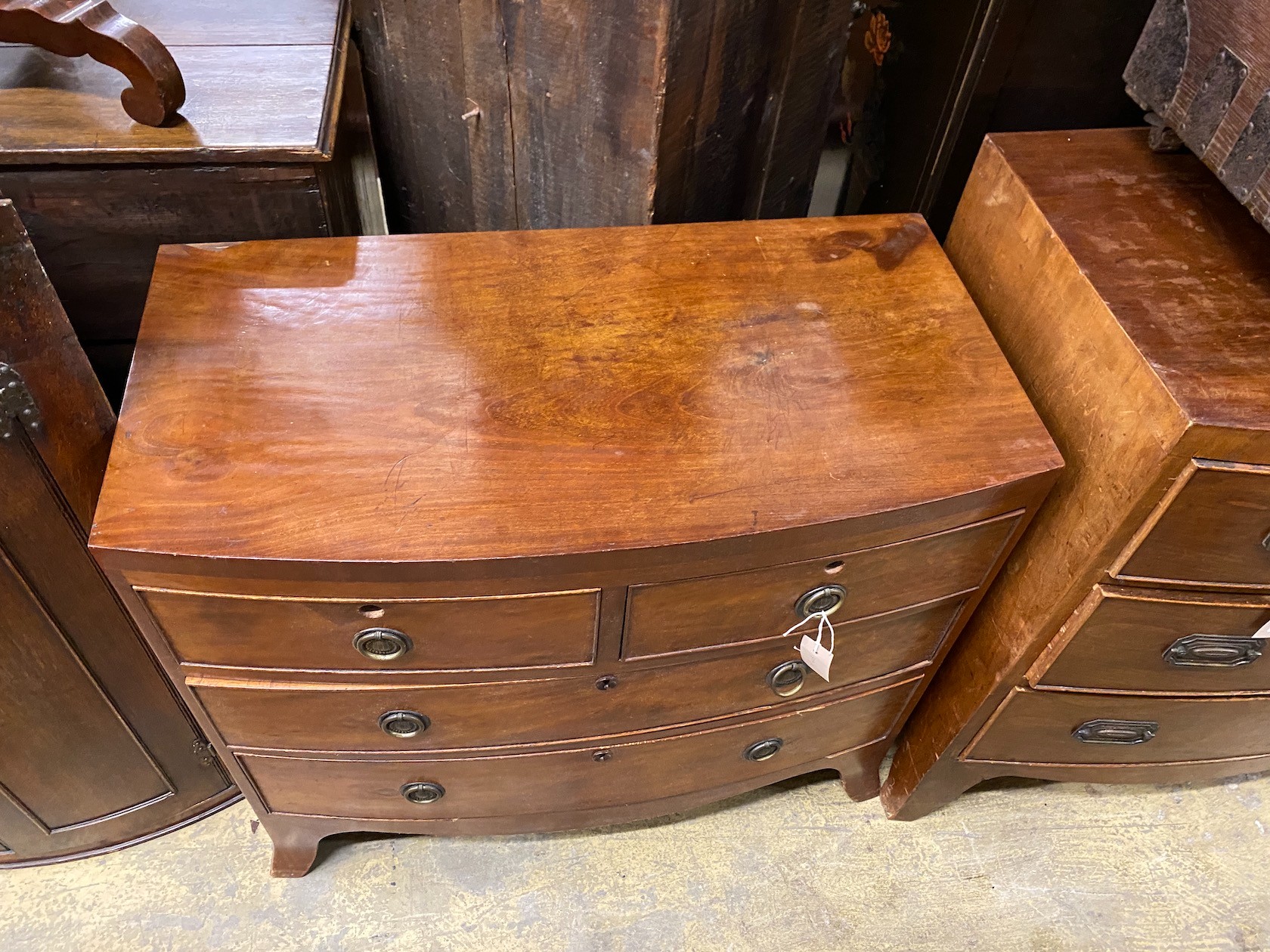 A small Regency mahogany bow front chest of drawers, width 83cm, depth 44cm, height 75cm